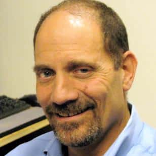 a photograph of Dan Taube, JD, PhD